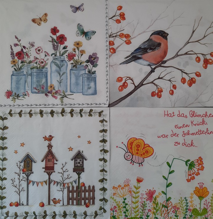 Vier Servietten mit bunten Vogel- und Blumenmotiven